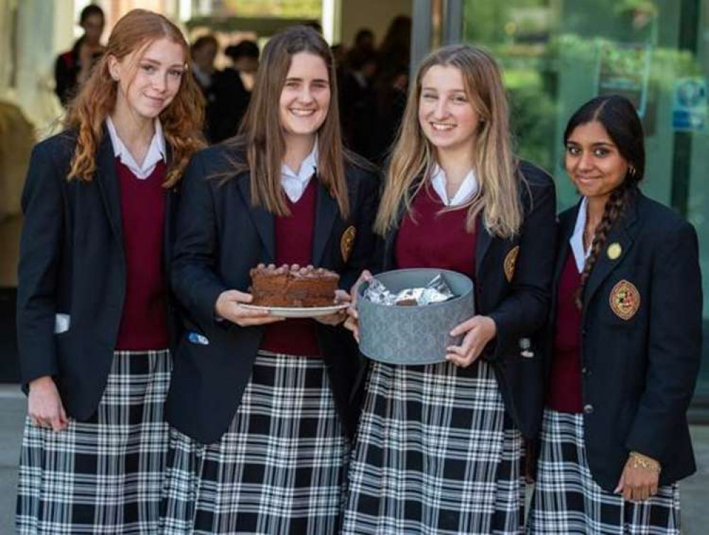 Oakham School Pupils with cakes they made and sold for charity