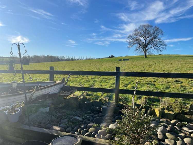 Rural views from the garden of this charming home (image courtesy of Moores)