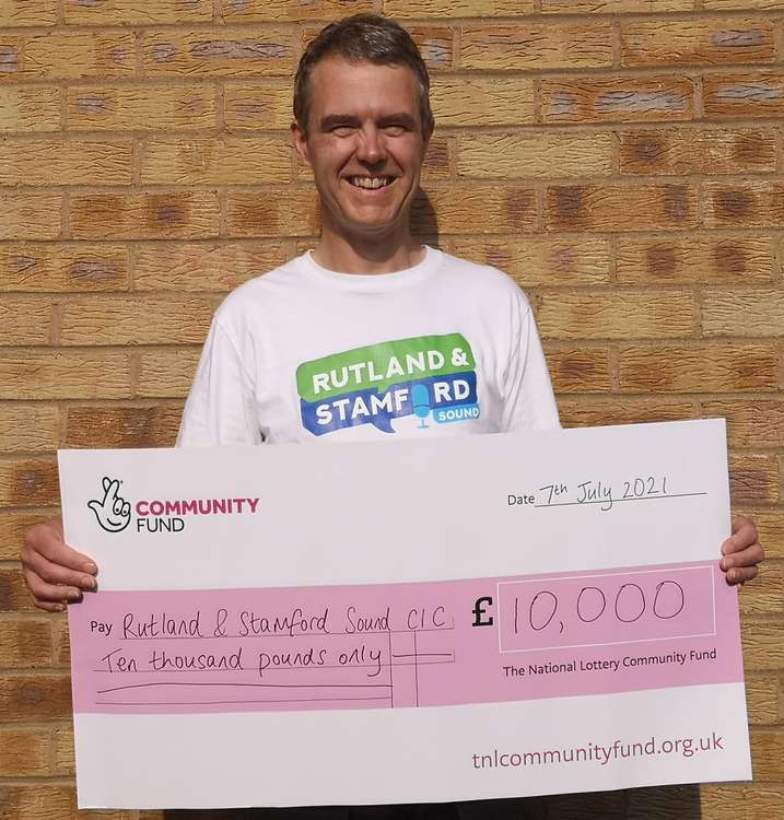 Rob with the £10,000 Lottery cheque (image courtesy of Rutland and Stamford Sound)