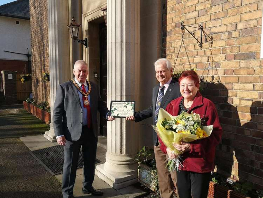 Gordon Shcumak and his wife, Chris (pictured) were finally presented with their award after Covid-19 restrictions. (Image credit: Penarth Town Council)