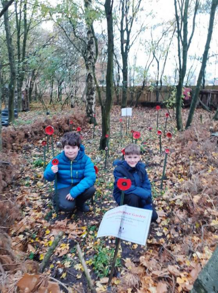 Pupils Kerem Danaci and Oliver Hyde who helped 'plant' the poppies