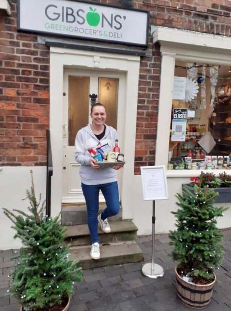 Emma holds a Christmas hamper which is providing popular due to the new service