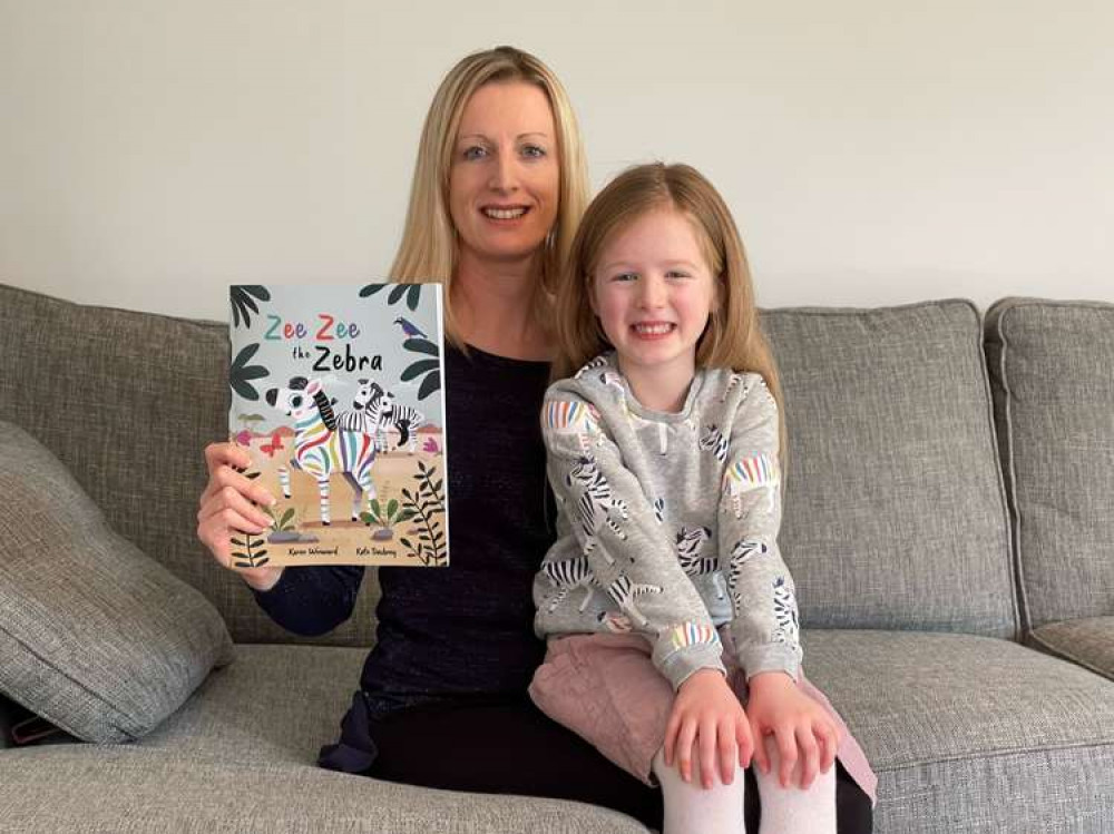 Karen with her daughter Issy and the book