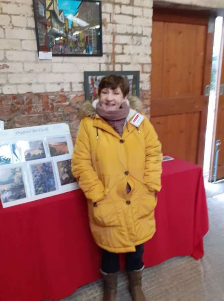 Sandbach artist, Kay Bayliss, at the exhibition with some of her work.