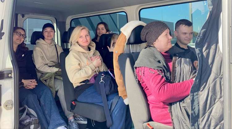 The packed mini bus with the three Ukrainian families