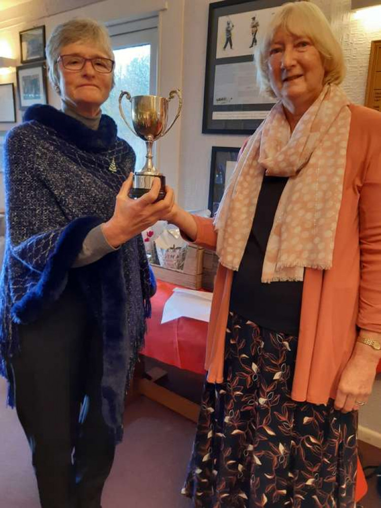 Karin Cox (left) and Stella Thompson (right) being presented by captain Anne Jarvis the first ever Joint Golfer of the Year trophy