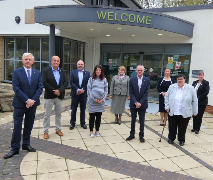 Members Of The Local Government Reorganisation Joint Committee Outside Mendip District Council's Headquarters In Shepton Mallet. CREDIT: Somerset Council.