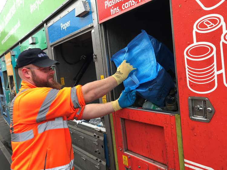 Recycling Being Loaded Into The New Suez Lorries By A Somerset Waste Partnership Employee. CREDIT: Somerset Waste Partnership. Free to use for all BBC wire partners.