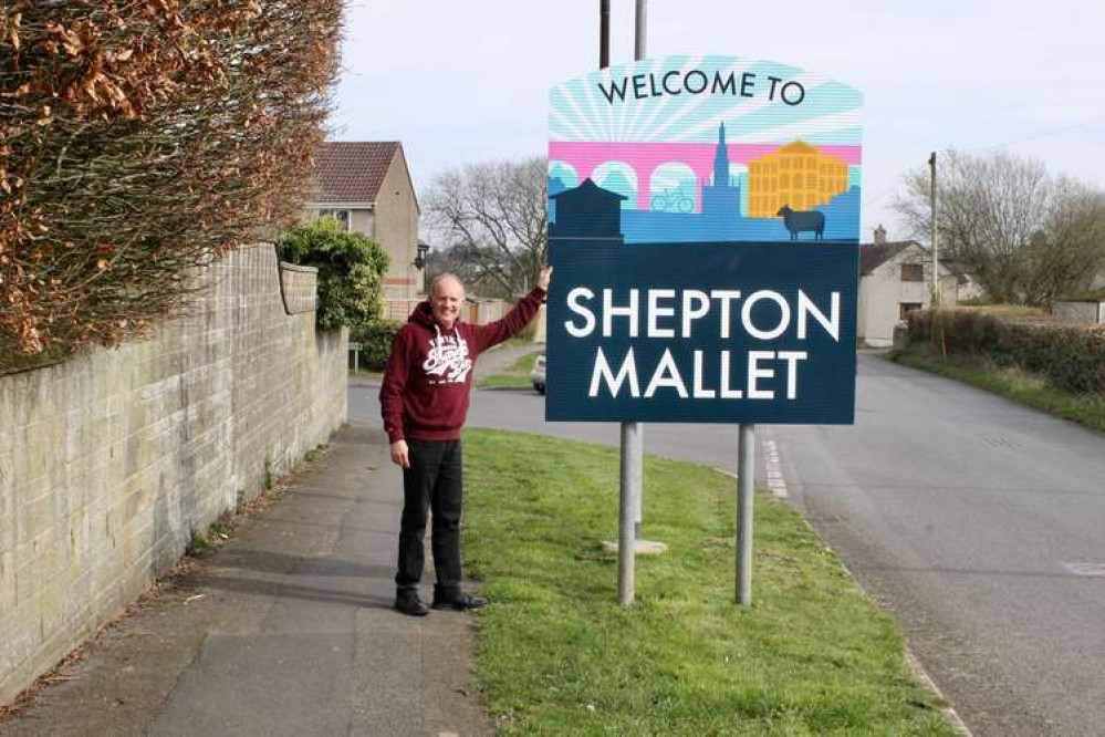 Cllr Matt Harrison with one of the new signs