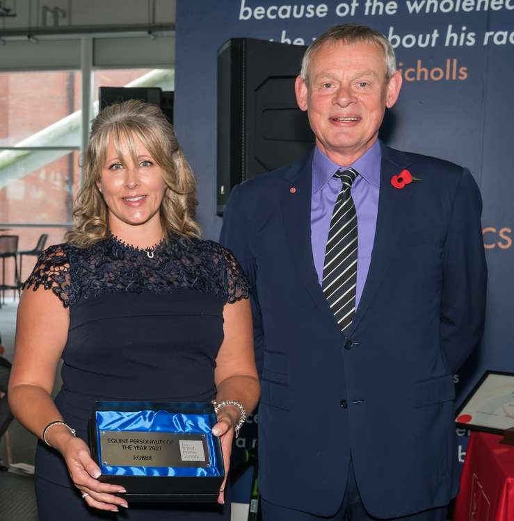 Sarah collecting award from BHS chairman Martin Clunes