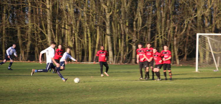 Woolverstone's Hayden Catchpole scores from free kick against Melton (Picture credit: Ian Evans/Nub News)