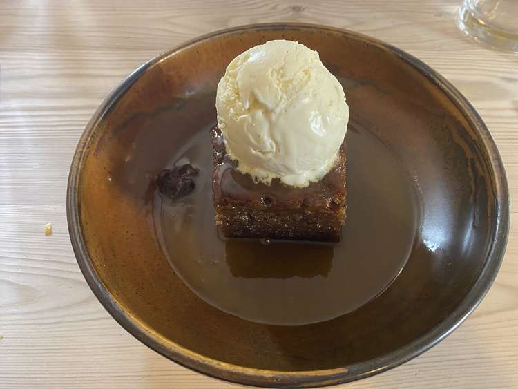 Sticky toffee pudding with toffee sauce and vanilla ice cream