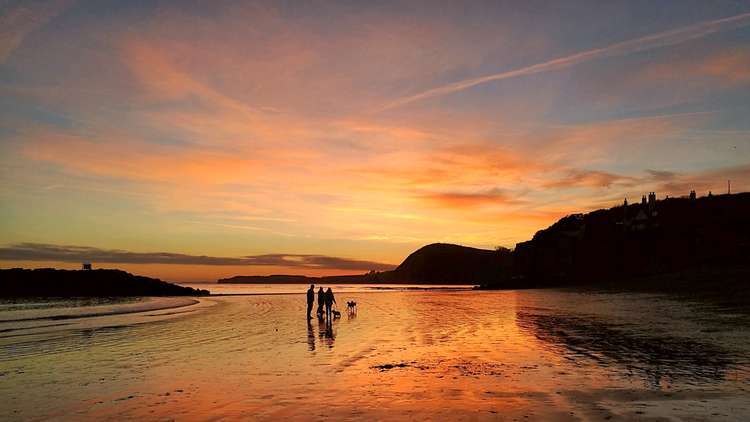 A sunset over Sidmouth beach. Credit: John Davis