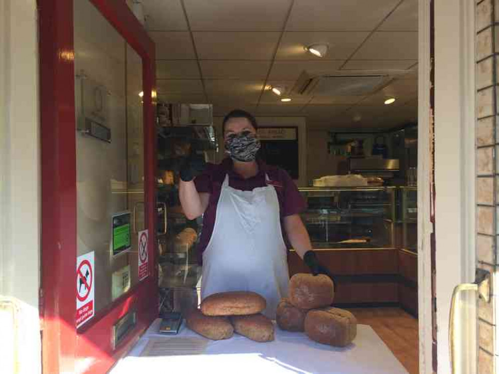 Fiona serving customers at Burns the Bread in Street this morning