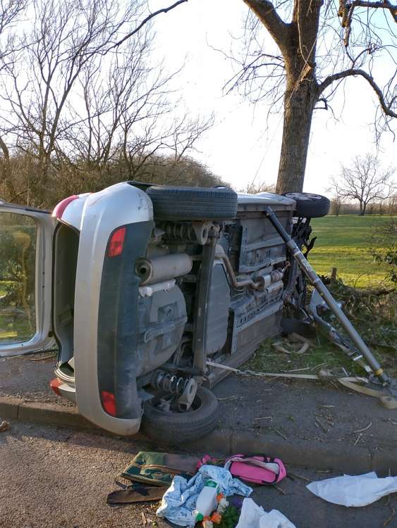 Photos show the car ended up on its side on Bath Lane. Photos: Swadlincote Safer Neighbourhood Team