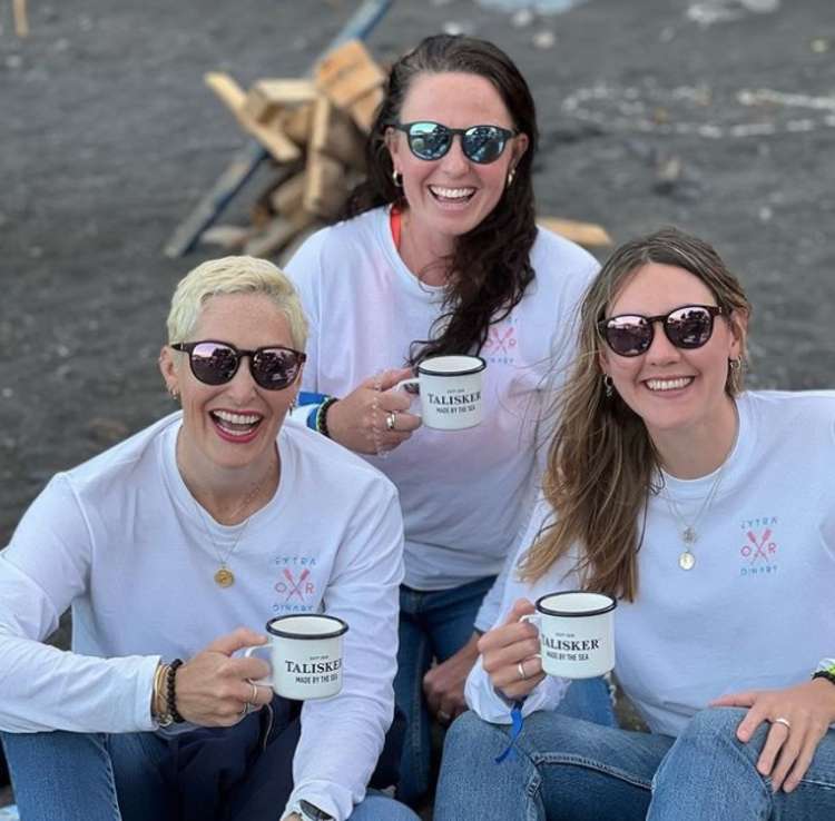 The girls have a pre-voyage cuppa wearing some ExtraOARdinary merch - available for supporters to buy