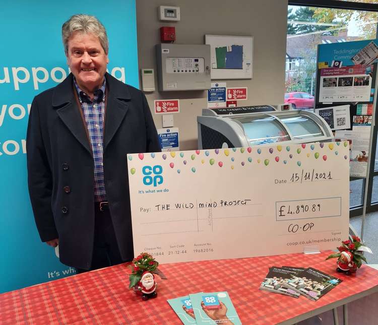 The Wild Mind project receives its cheque at Teddington's Kingston Road Co-op (Image: Co-op)