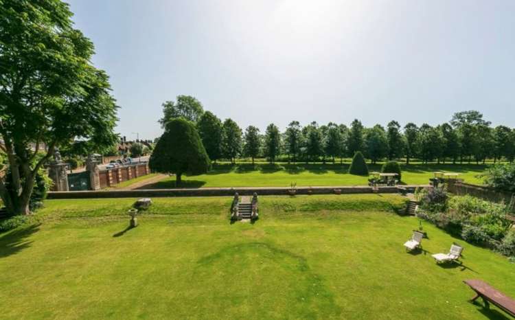 The manor shares garden walls with the historic palace