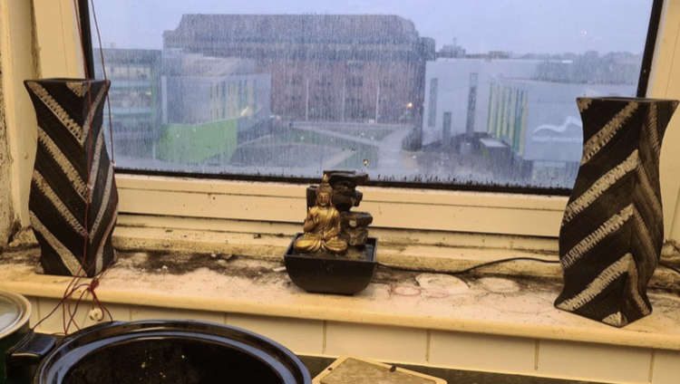 Differing worlds: Thurrock Council HQ viewed from a mouldy borough flat where residents live amid health-threatening damp, cold and mould.