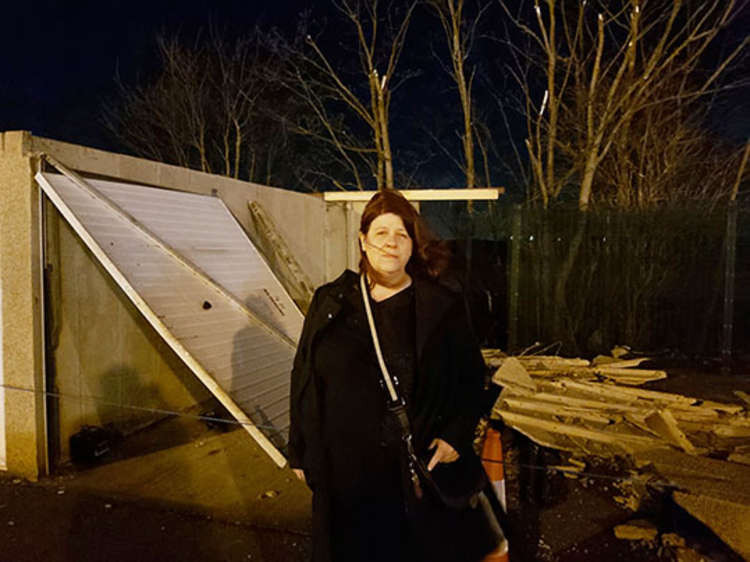 Cllr Sara Muldowney at the scene of the damaged garages.