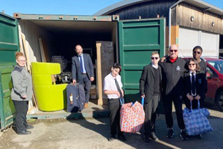 Anthony Hattam, Tarnya Bennett and Tom Flynn with some of the youngsters who helped load goods for the Ukraine.