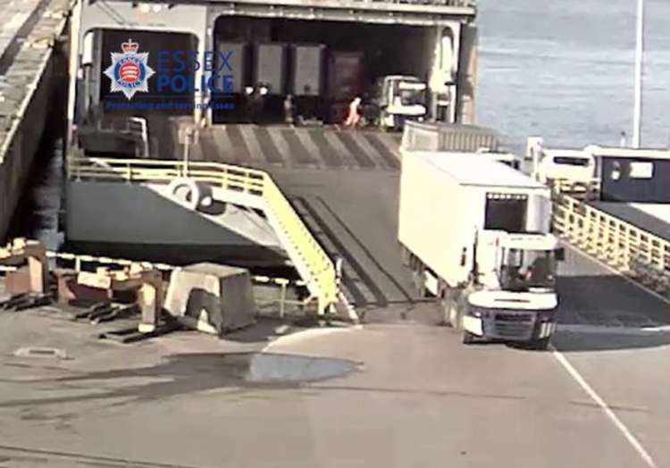 CCTV footage showing dock workers loading a trailer onto a ship in Zeebrugge, Belgium - believed to be the one containing the migrants.