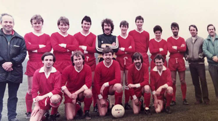 Team leader: Doug (left) pictured with one of the many groups of players he guided through local football.