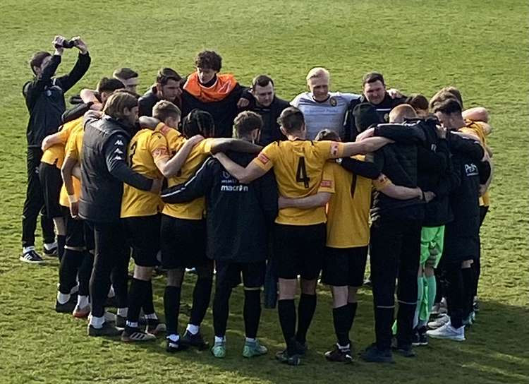 East Thurrock concentrate their thoughts moments after the end of today's game.