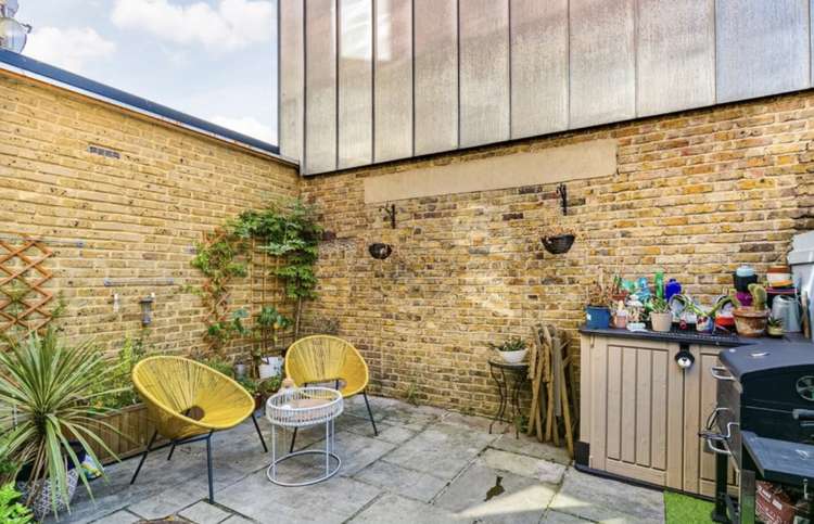 A south-facing patio which is perfect for al fresco dining (credit: Savills)