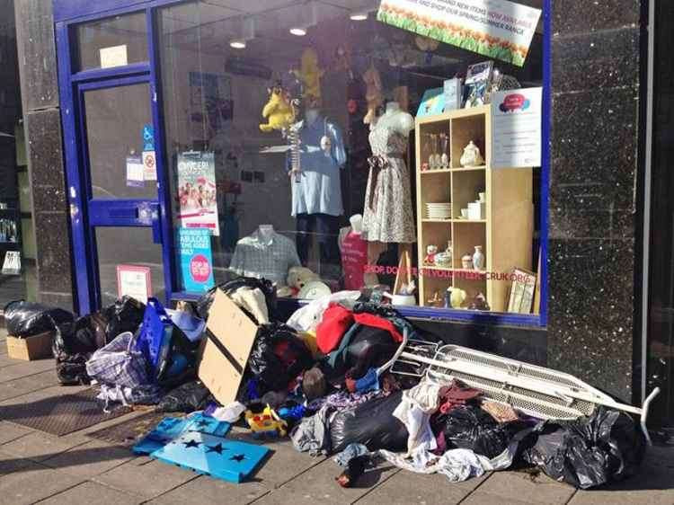 The closure of charity shops saw items piled high on the pavement outside many outlets.