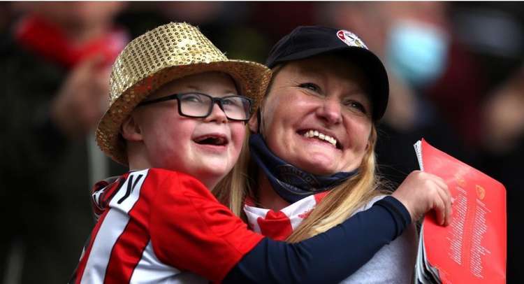 Natalie O'Rourke (right), proprietor of Park Lane Stables, Teddington, with her son Woody (left) (Image: Getty)