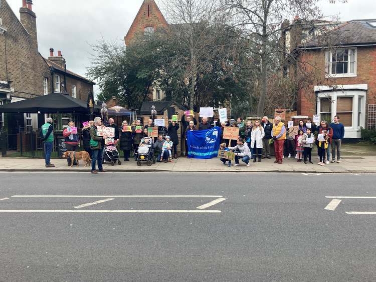 More than 40 people gave up their Bank Holiday to fight a developer's plans to fell trees close to Twickenham Green.