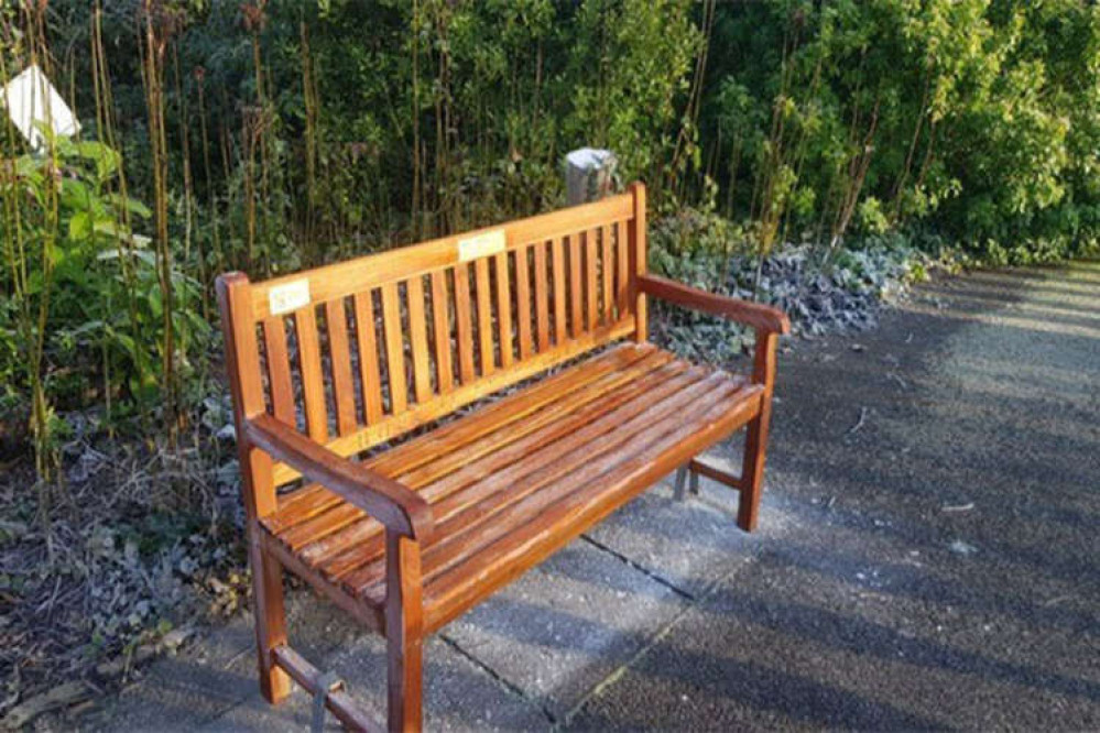 The bench is inscribed with a quote from After Life 'Hope is Everything' and is located in York House Gardens, Twickenham, TW1 3DD.