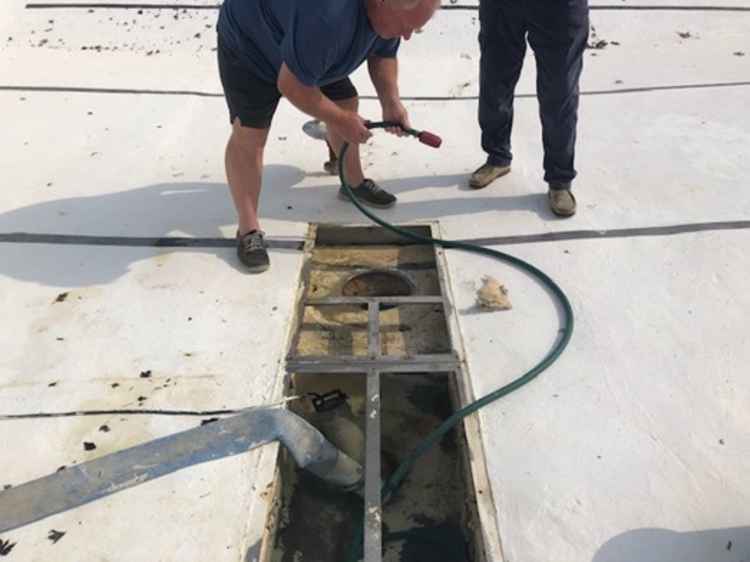 The Onsite team and Dave Mogg checking the main pipes from the pool