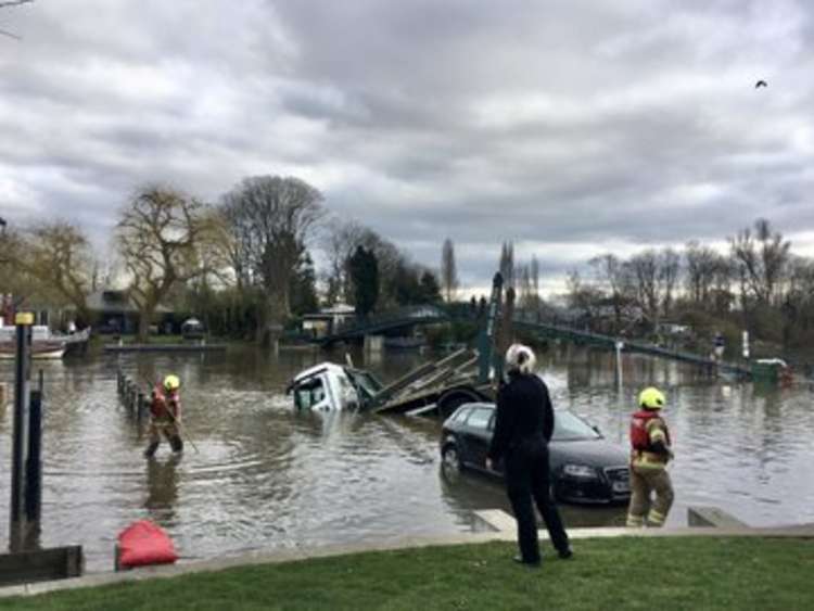 One onlooker suggested the fact that the water was flooding the riverside car park meant the driver was unable to see the edge of the hard standing. Credit: Ruth Wadey.