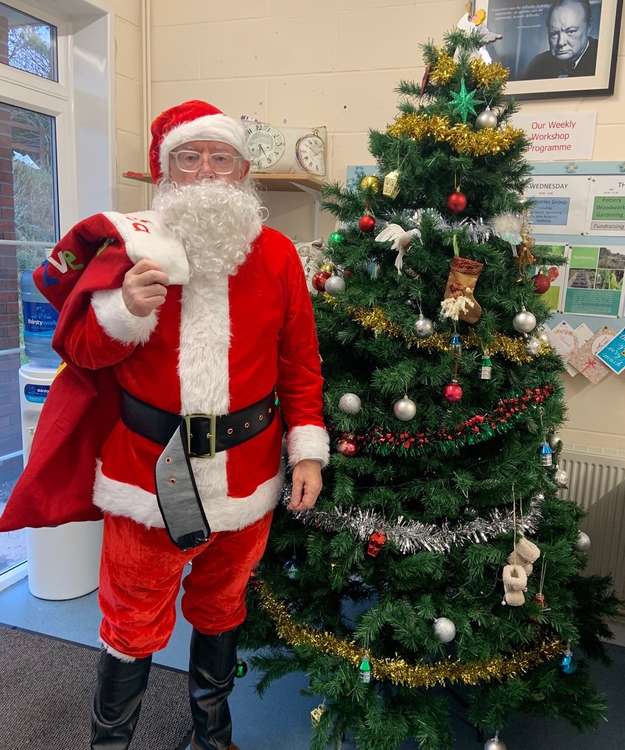 The Mayor of Wells transformed into Santa Claus to give the presents