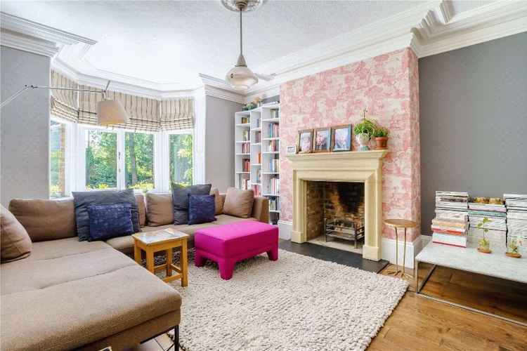 Bole oak flooring and a stone open fireplace are attractive period features of Alan Turing's former home. (Image Savills)