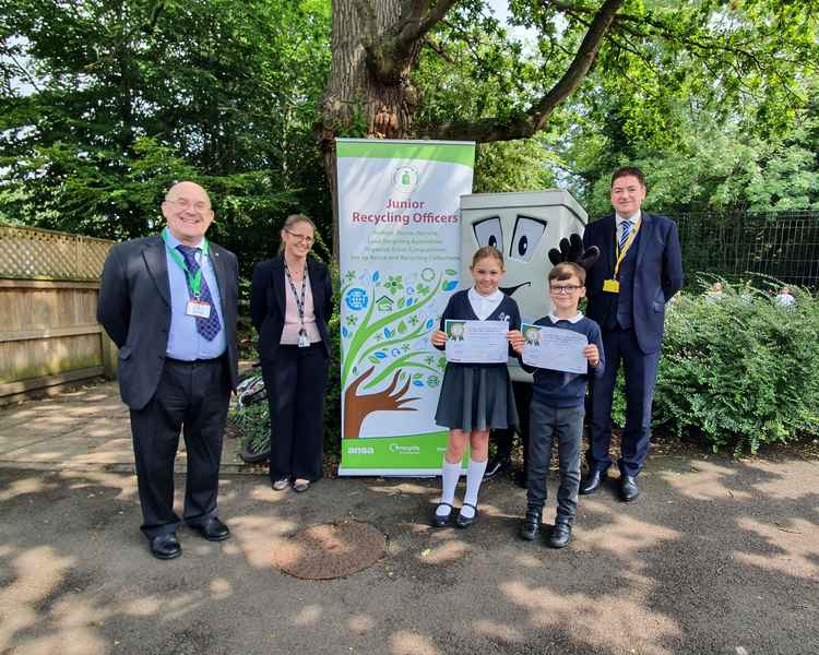 Councillor Steve Hogben, Lindsey Walsh, headteacher at Alderley Edge Community Primary School, the two Junior Recycling Officers of the Year 2021 with Ansa's 'Phil the Bin' and Alderley Edge Councillor Craig Browne. (Image - Cheshire East Council)