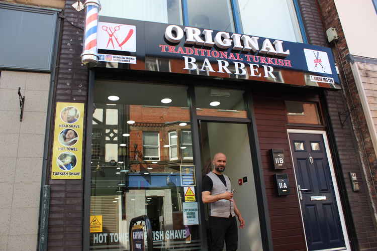 The Grove Street barbers are hiring, and have a five-star rating on Facebook.