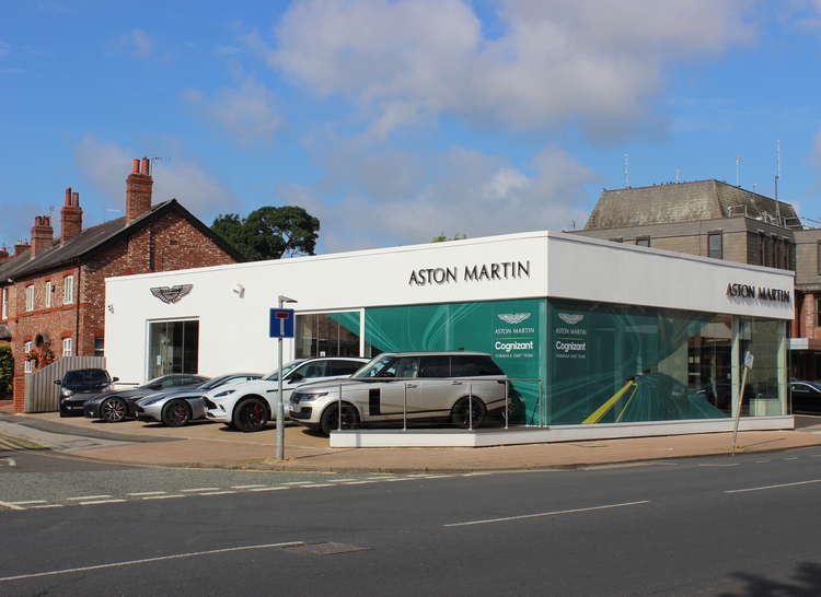 Wilmslow's Water Lane Aston Martin dealership. The amount of expensive cars in our area may be a reason for low bus use, however, it is the same small figures for across our borough. An average person makes 13 trips a year.