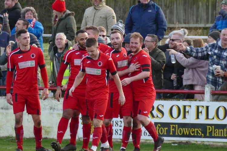 On the road: Players celebrate with Josh Ruff after he put Atherstone ahead in the 41st minute . . . all pictures by Nick Hudson