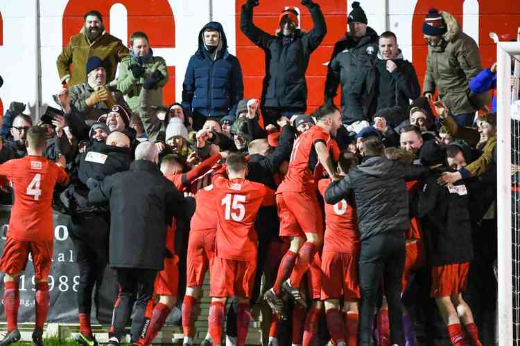 Sheer delight: As Atherstone Town's players celebrate THAT moment with their travelling fans