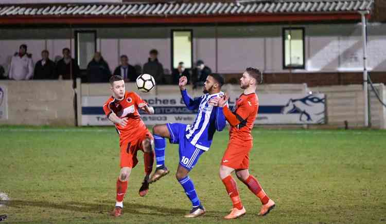 Three's a crowd: Atherstone players tighten their grip on the FA Vase game