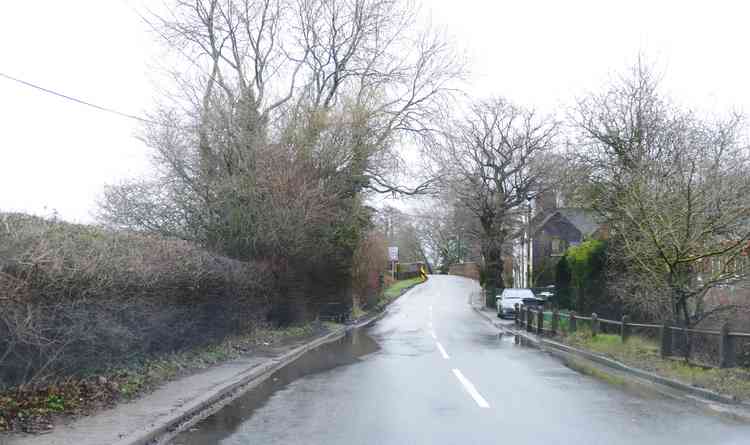 Almost gone: The floodwaters in Spon Lane, Grendon
