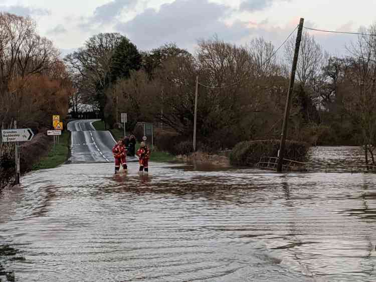 In deep water: Two firefirefighters from Polsworth station illustrate the problems