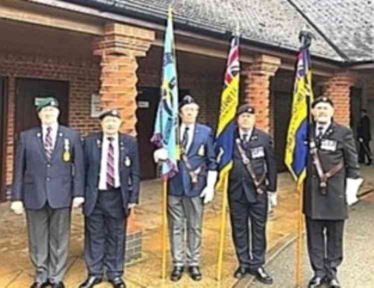 Fibnal salute: Flag bearers at his funeral at the Heart of England Crematorium, Nuneaton