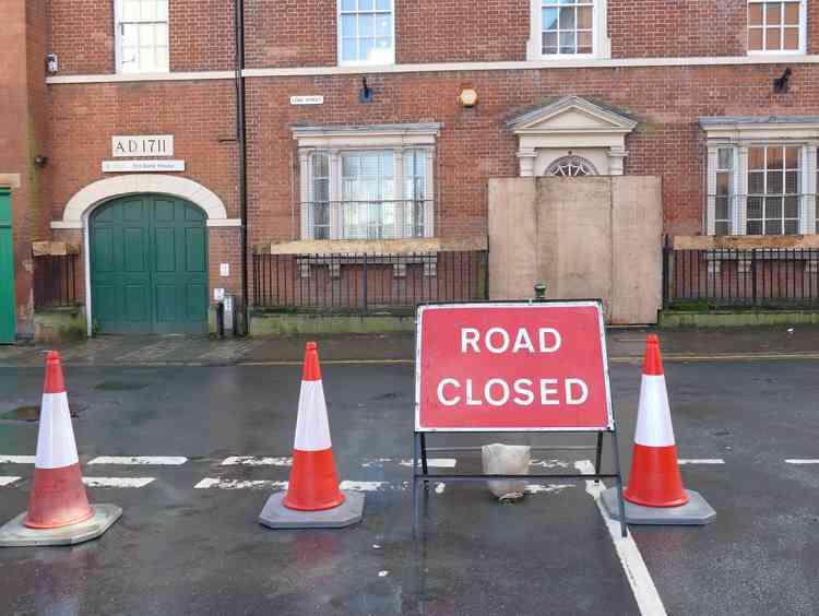 Signing on: The 'road closed' prepares the town for the event