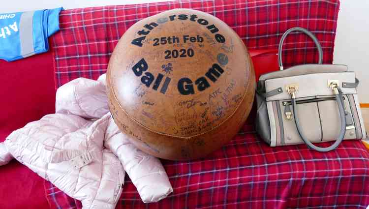 Display case: The 2020 ball alongside a jacket for all weathers and a lady's handbag