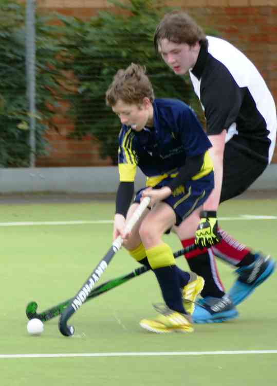 Getting stuck in: Bradley Wakeford-Davy, right, scraps for the ball in midfield