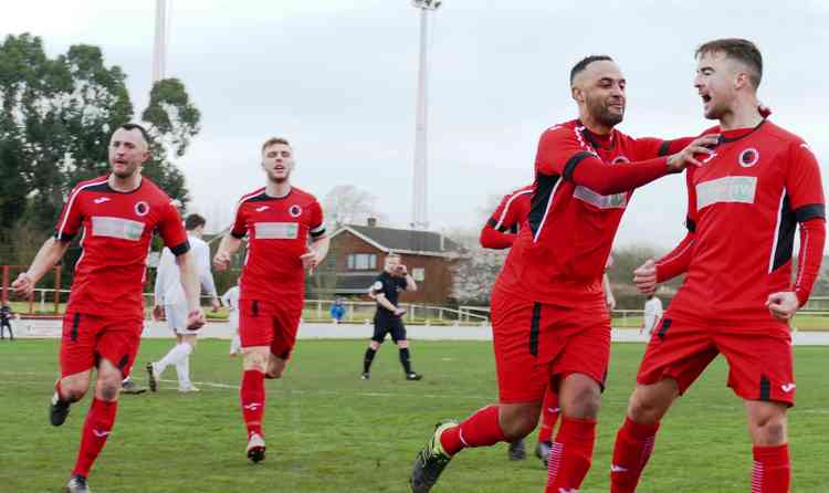 Off and running: Joe Obi celebrates with Ryan Quinn